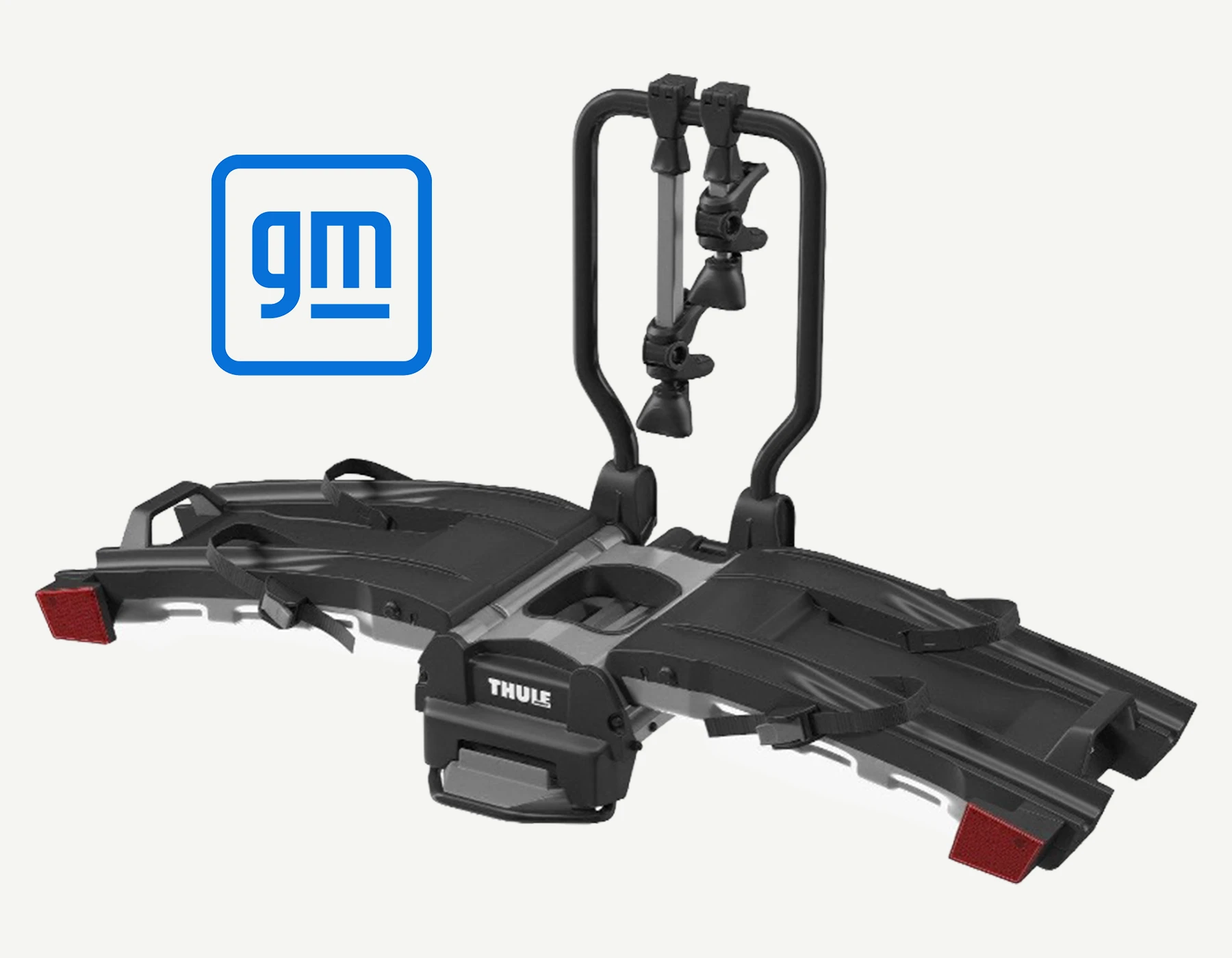 Thule EasyFold XT bike rack beside the blue General Motors logo.